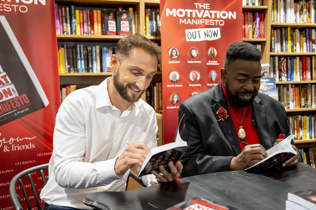 Signing copies of The Motivation Manifesto with Les Brown at the launch