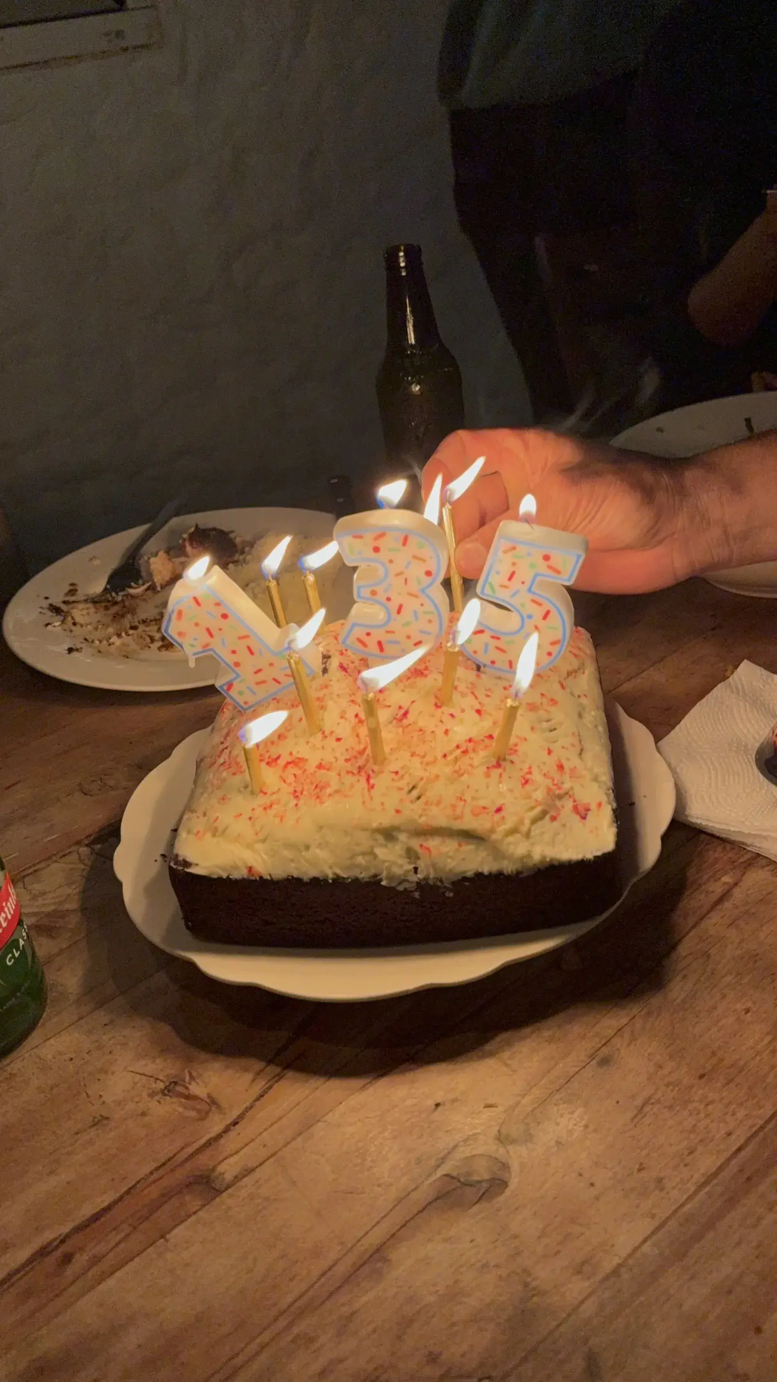 How cool is it to celebrate three birthdays together with some amazing friends on a random island in the South Pacific, getting ready to swim with humpbacks? Birthday cake with candles reading 135, the combined age of three birthdays celebrated in Tonga, sober celebration, Nomadic Addictt.