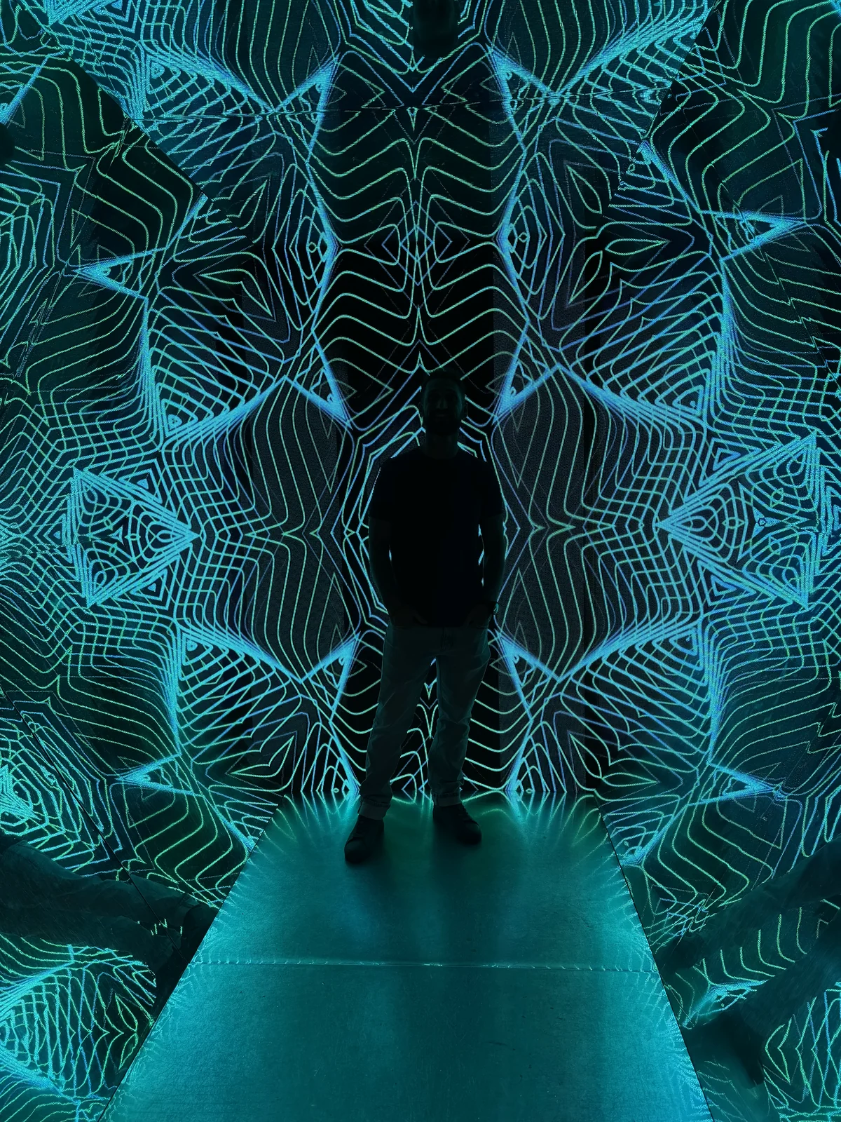 All of it happens inward. Standing alone inside a teal light installation, on the metta practice I use for letting go of someone I still love, Love Unlocked