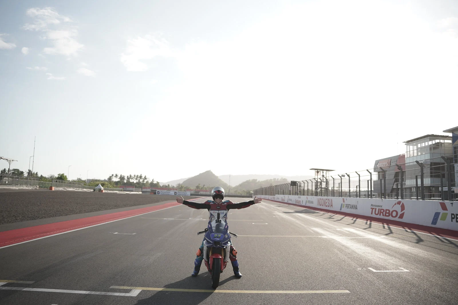 Mandalika main straight, September Me with my arms wide open on the main straight at Mandalika circuit