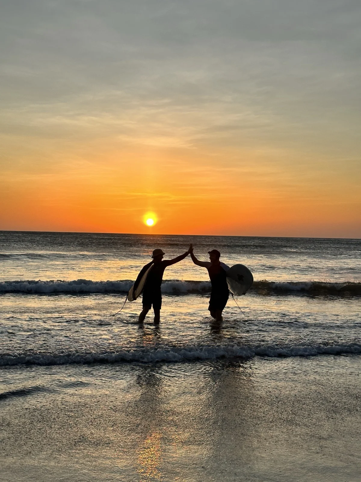 My dad and I surfing together