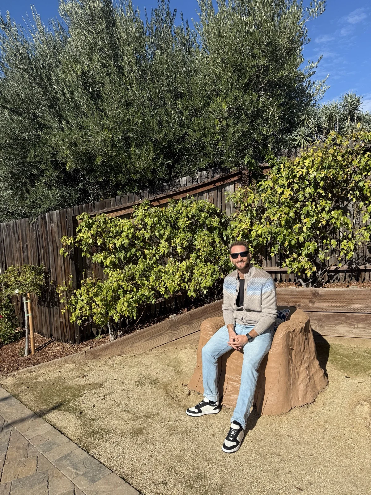 Grounded and present, no drink required. | Zac Spowart sitting calmly outdoors in the sun, on managing anxiety without alcohol, Nomadic Addictt. Grounded and present, no drink required. | Zac Spowart sitting calmly outdoors in the sun, on managing anxiety without alcohol, Nomadic Addictt.